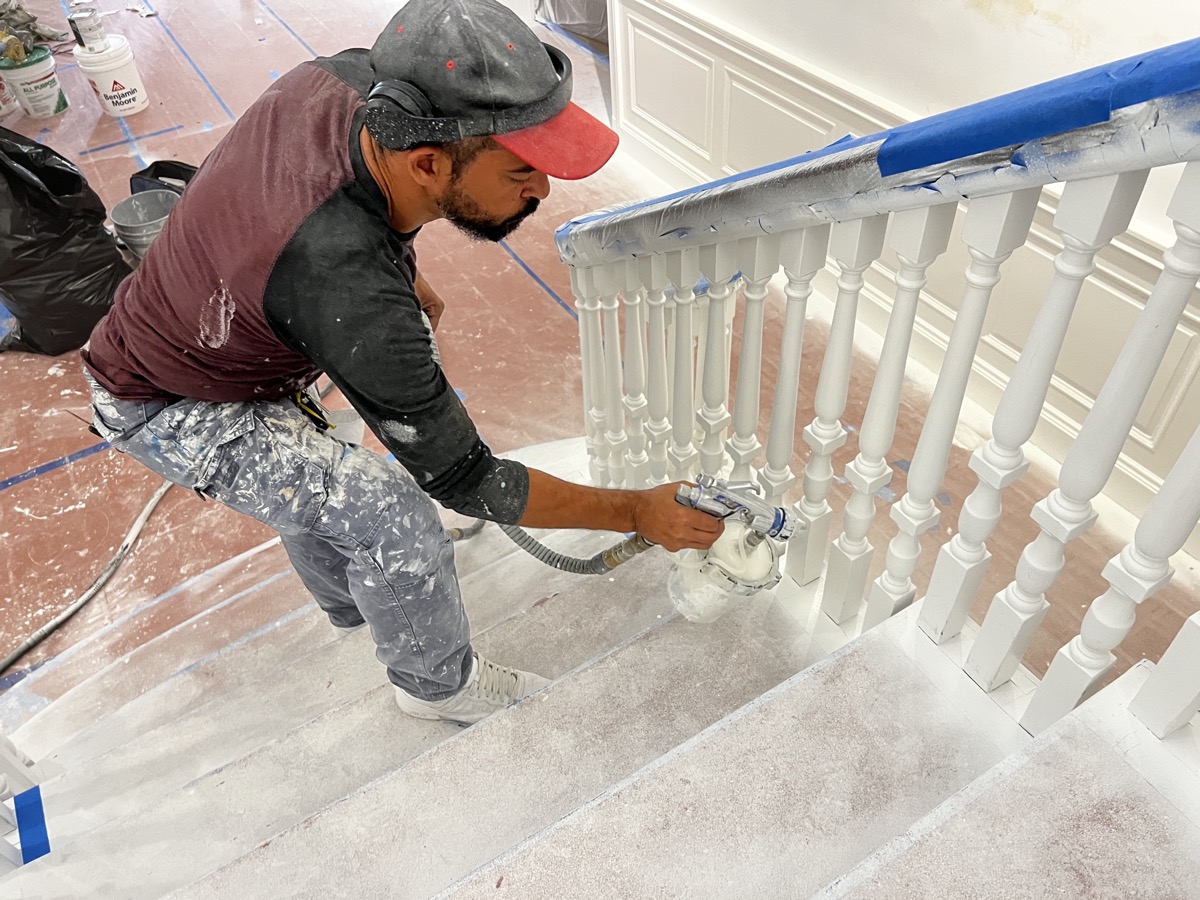 Man painting a staircase